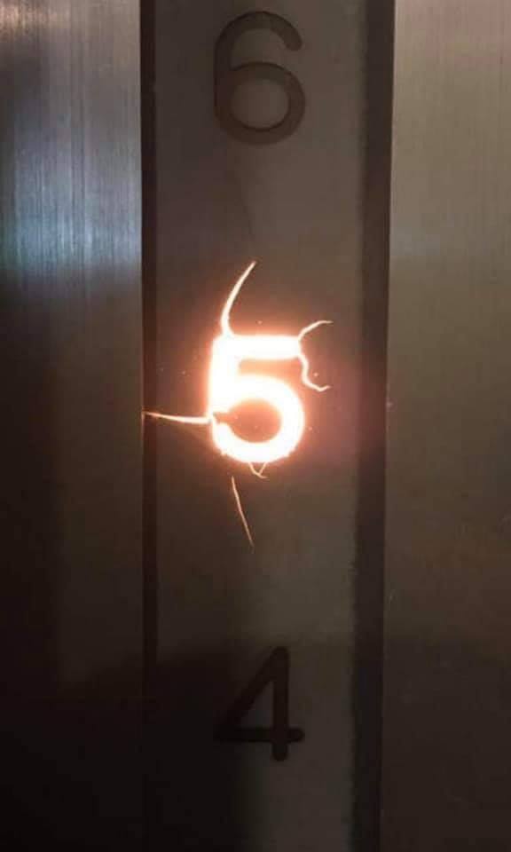 This meme features a photo of a elevator floor indicator with the numbers 2 and 3 missing, and the number 5 lit up with a bright, glowing effect. The text "5" is also highlighted with a red circle, implying that the elevator has stopped on the 5th floor.